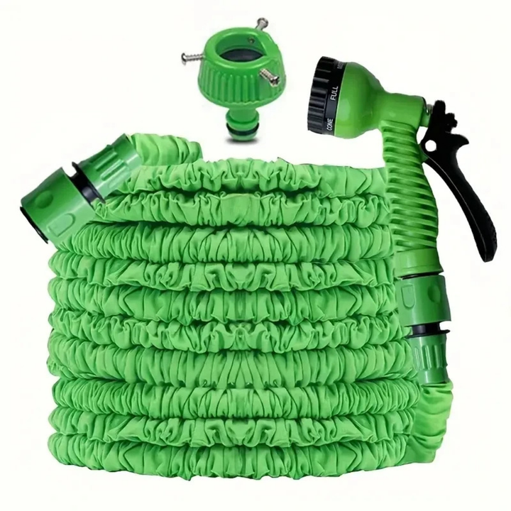Flexible garden hose in bright green, extended across a lawn, ideal for watering outdoor plants and gardening.