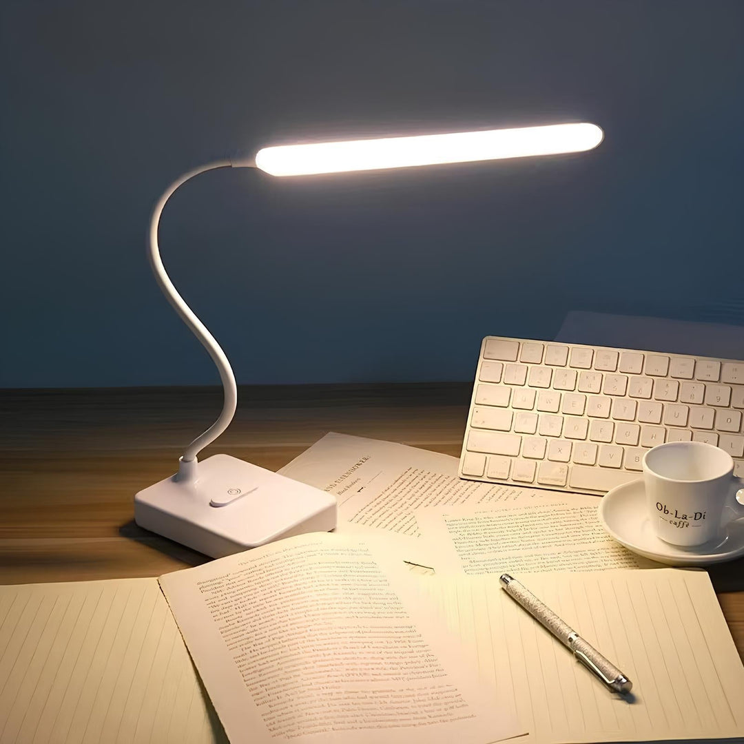 Modern LumoFlex LED desk lamp with flexible arm. Dimmable light for comfortable reading & task work.
