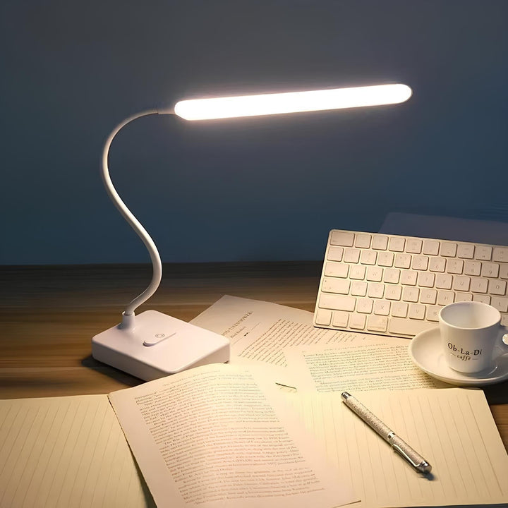 Modern LumoFlex LED desk lamp with flexible arm. Dimmable light for comfortable reading & task work.