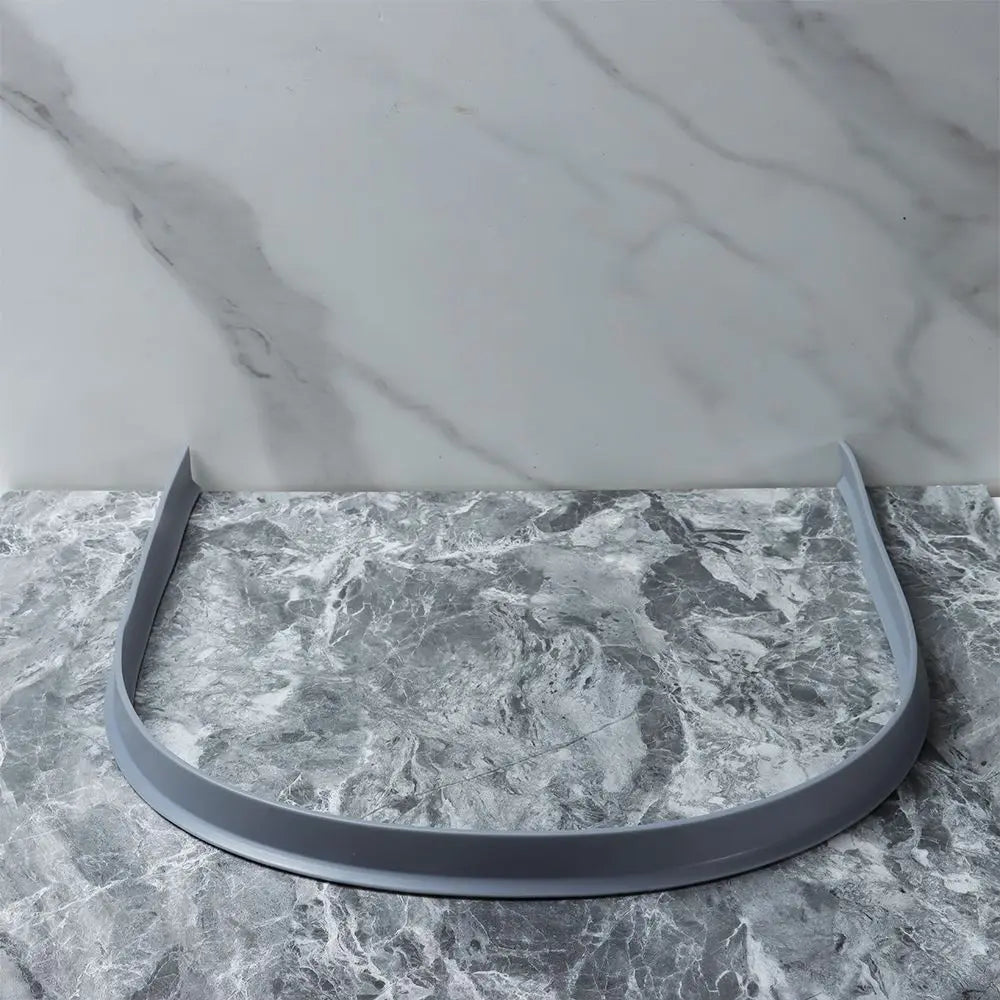 Protect your bathroom with this flexible silicone water stopper & splash guard.