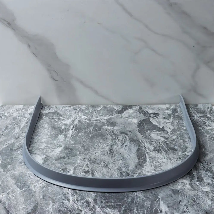 Protect your bathroom with this flexible silicone water stopper & splash guard.