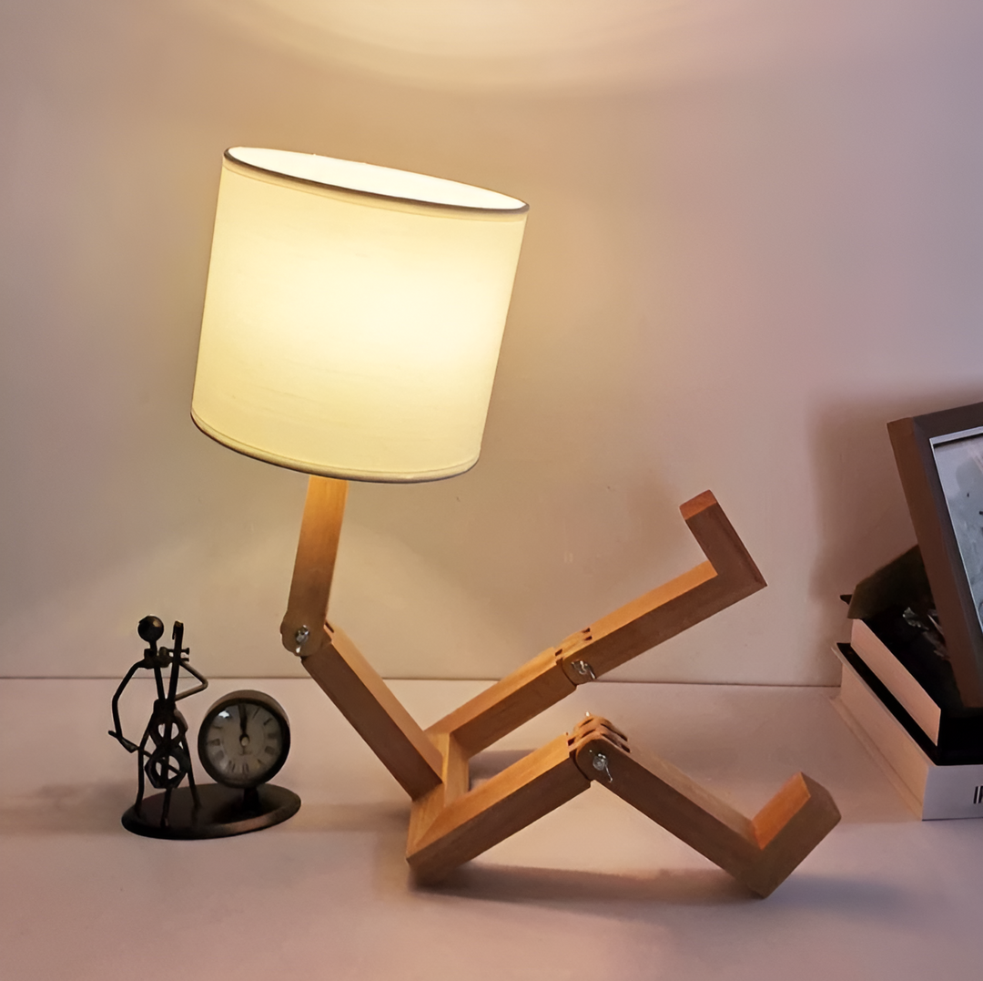 Whimsical LumoBot flexible wood robot desk lamp, adjustable lighting for home, office, and decor.