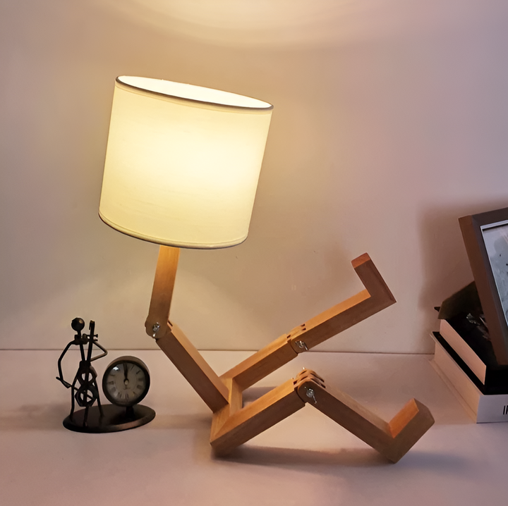Whimsical LumoBot flexible wood robot desk lamp, adjustable lighting for home, office, and decor.