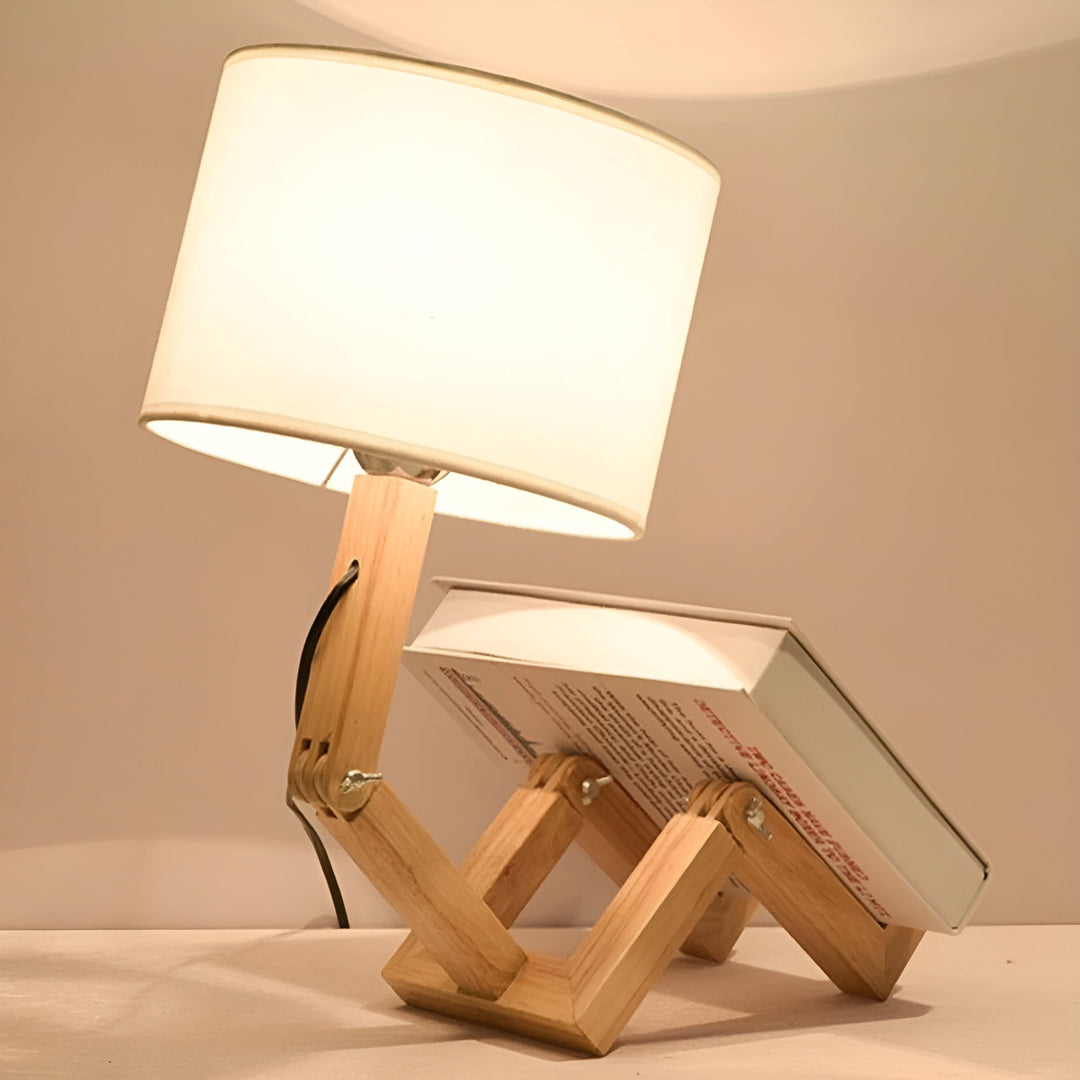 Whimsical wooden robot desk lamp, flexible design, perfect for unique home decor & office lighting.