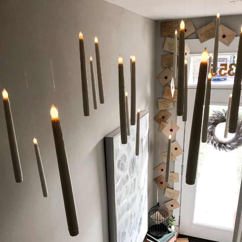 Floating LED candles illuminate a magical home decor scene, perfect for enchanting ambiance & party decorations.