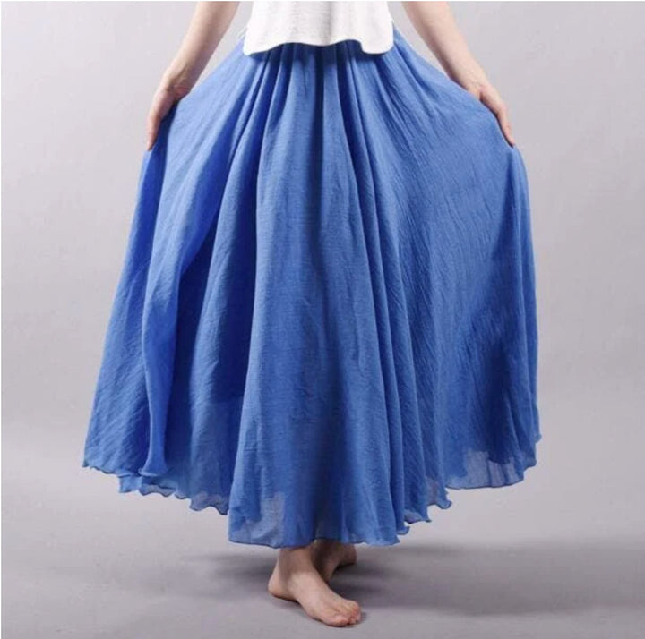 Flowing bohemian high waist maxi skirt for women, perfect for summer casual or vacation beach style.