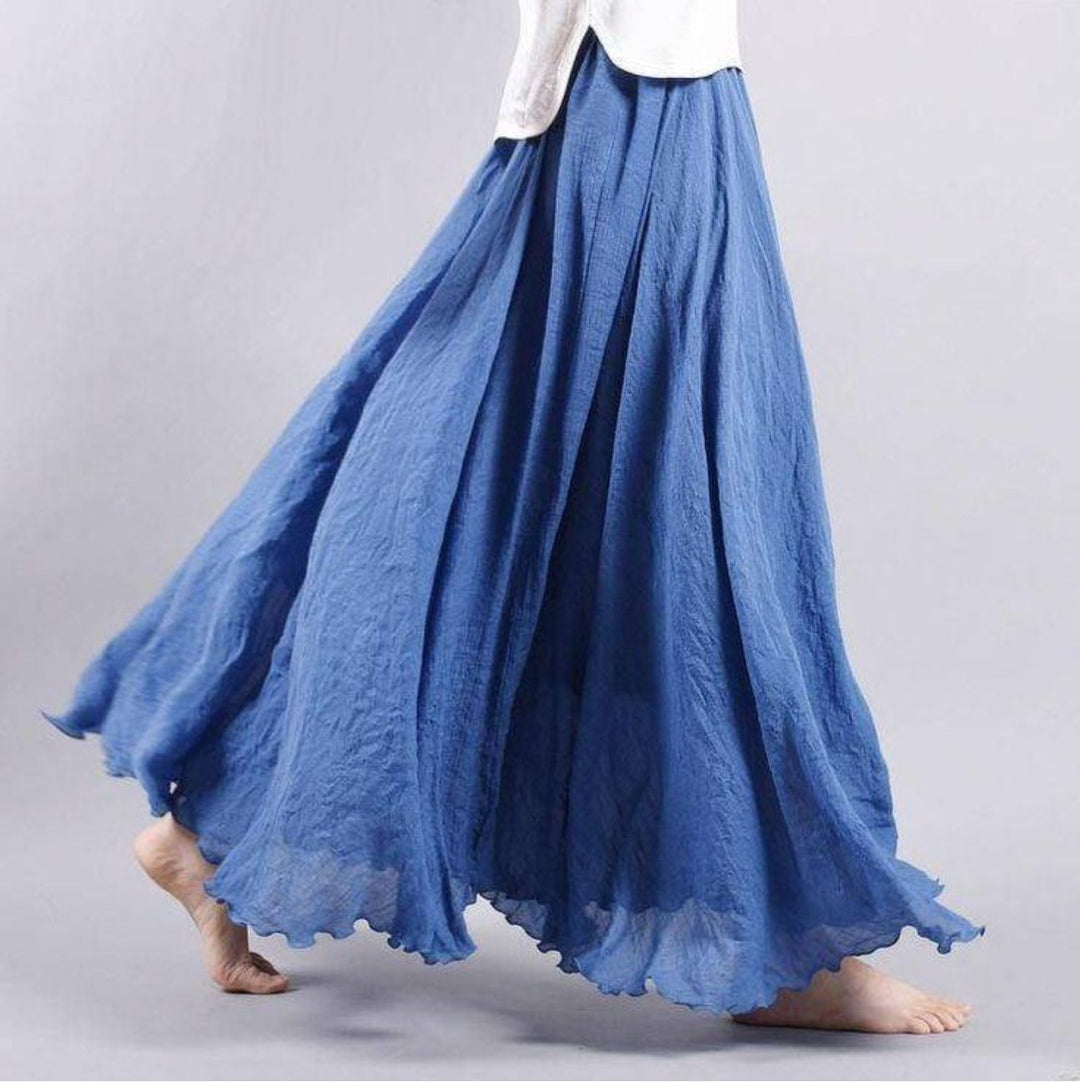 Chic women's flowing high-waist maxi skirt, a versatile bohemian style for summer, beach, or casual elegance.