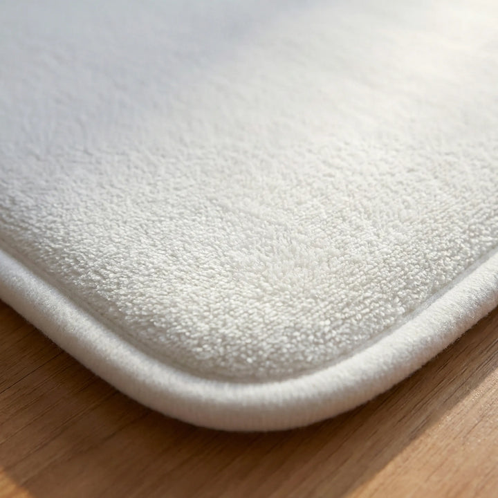 Stylish Flowique wave design alarm mat, a smart pressure sensing wake up aid for your morning routine. Essential bedroom gadget.