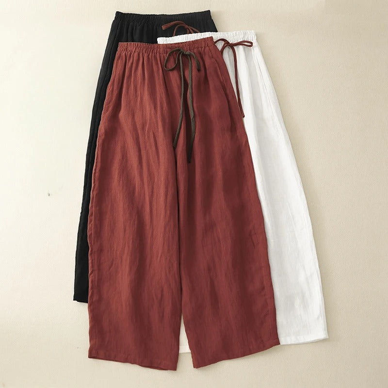 White versatile flowy wide-leg pants, perfect for casual chic or comfortable, relaxed fit resort style.