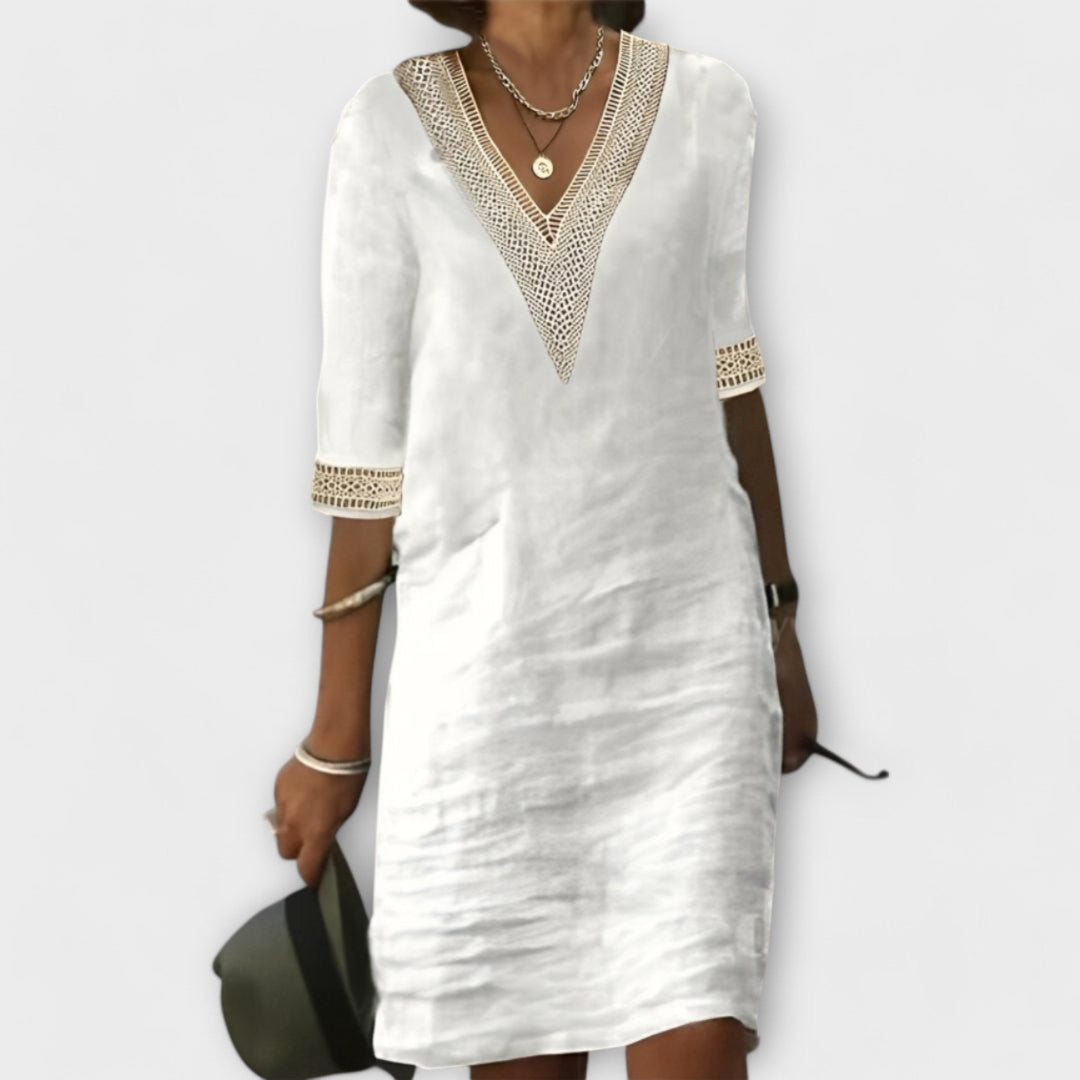 Flowy women's crochet midi dress with intricate openwork design, perfect for boho-chic summer casual or beach wear.
