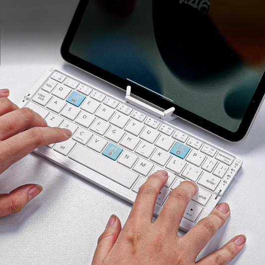 Foldable Bluetooth keyboard for tablets & phones, ultra-portable wireless design for on-the-go productivity.