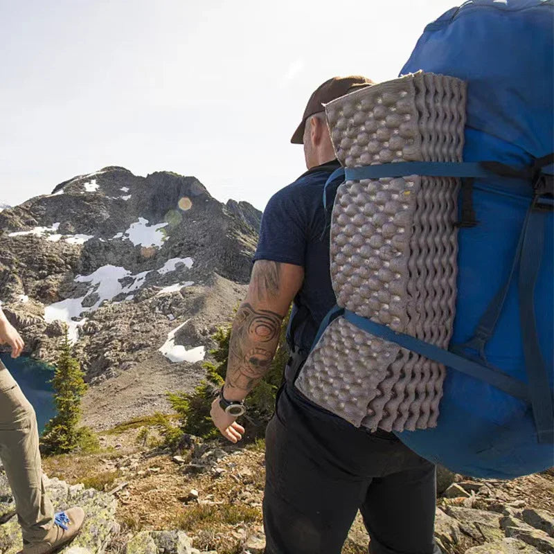 Compact outdoor foam mat for sitting, essential waterproof camping gear, easily foldable design
