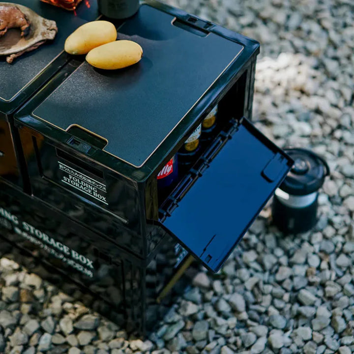 Grey folding storage crate with light wood lid, modern camping accessory