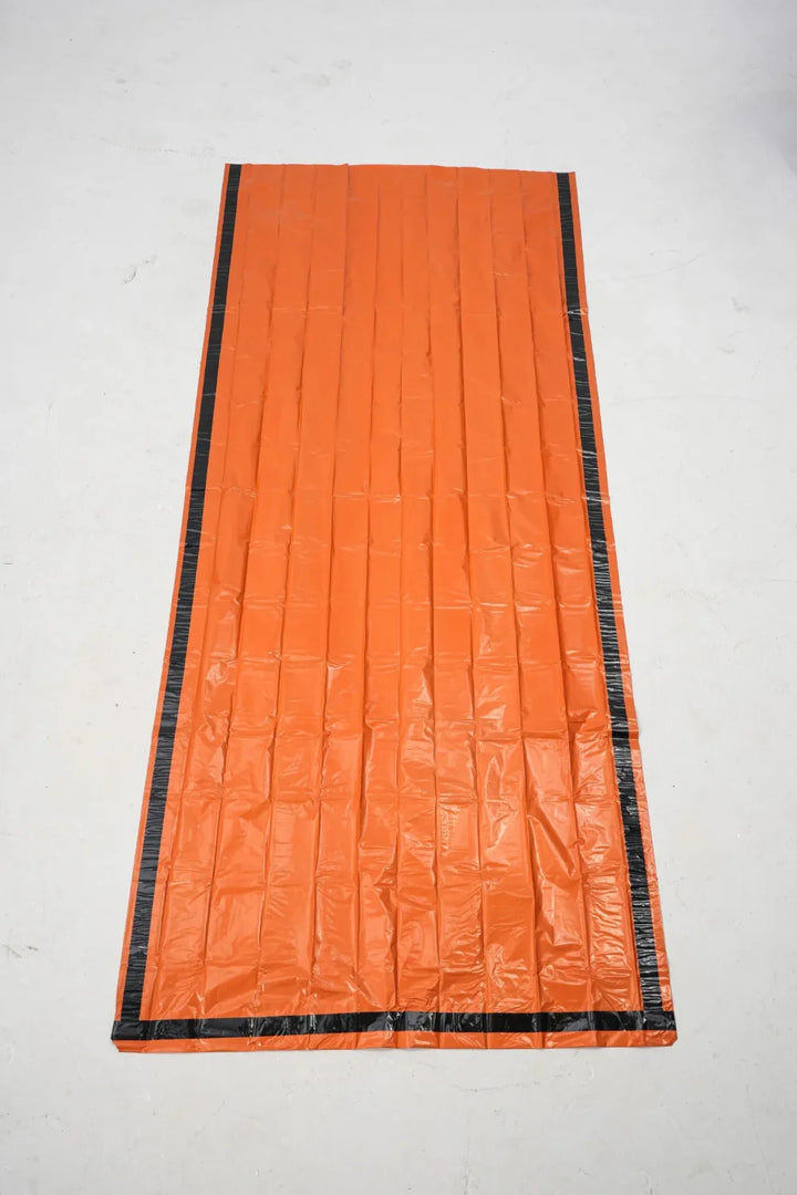 Thermal emergency sleeping bags, 4-pack, in original packaging, ready for camping, hiking & survival kits.