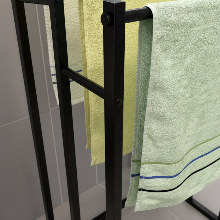 Three-tier freestanding steel towel rack to neatly organize multiple bath towels in your bathroom.