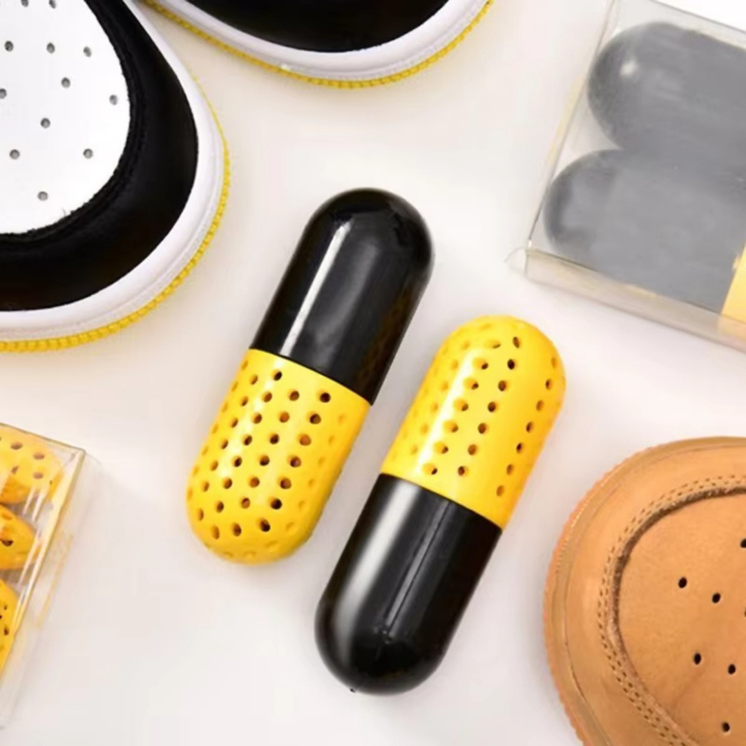 Arrangement of FreshKick Capsules bottle and scattered capsules, for daily vitality