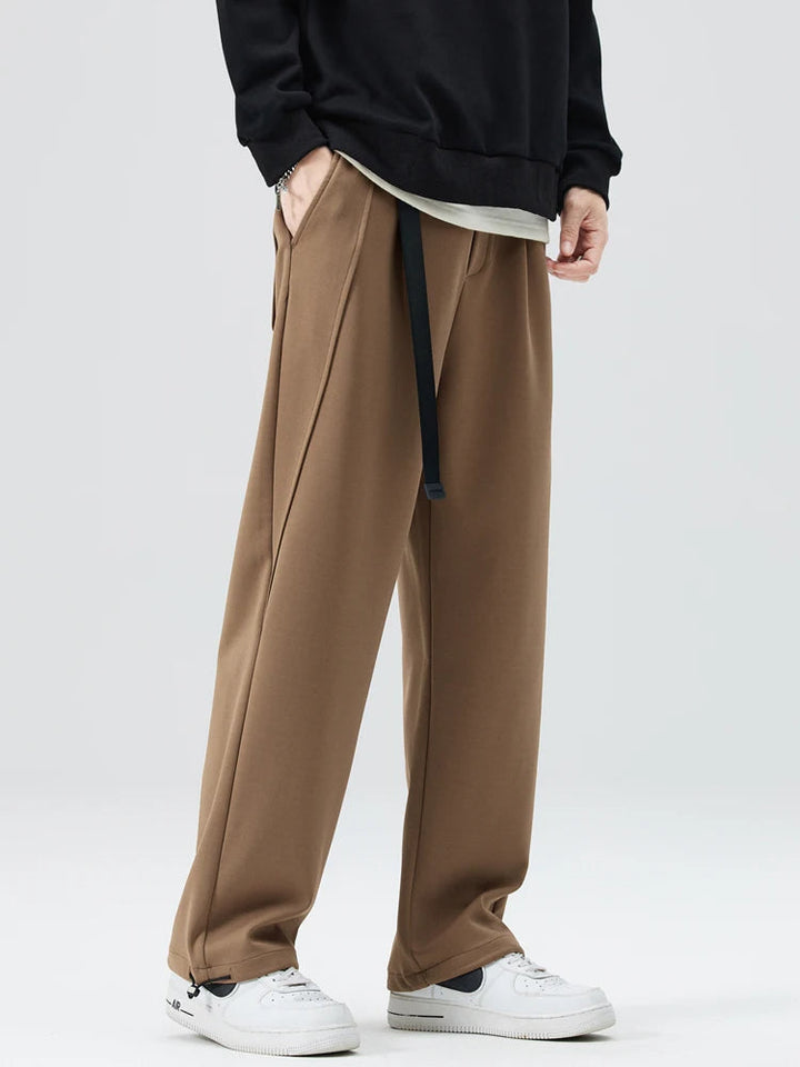 Folded men's wide-leg trousers, ready for everyday wear, emphasizing their comfortable, relaxed fit.