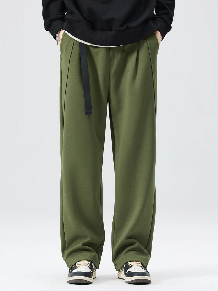 Comfortable, relaxed fit men's wide-leg trousers with a stylish drawstring waist for modern comfort.