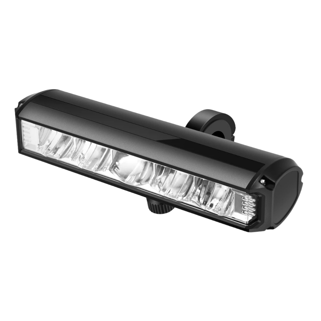 Frontlight Maxi headlamp worn by a person hiking on a trail at dusk, showing bright LED beam