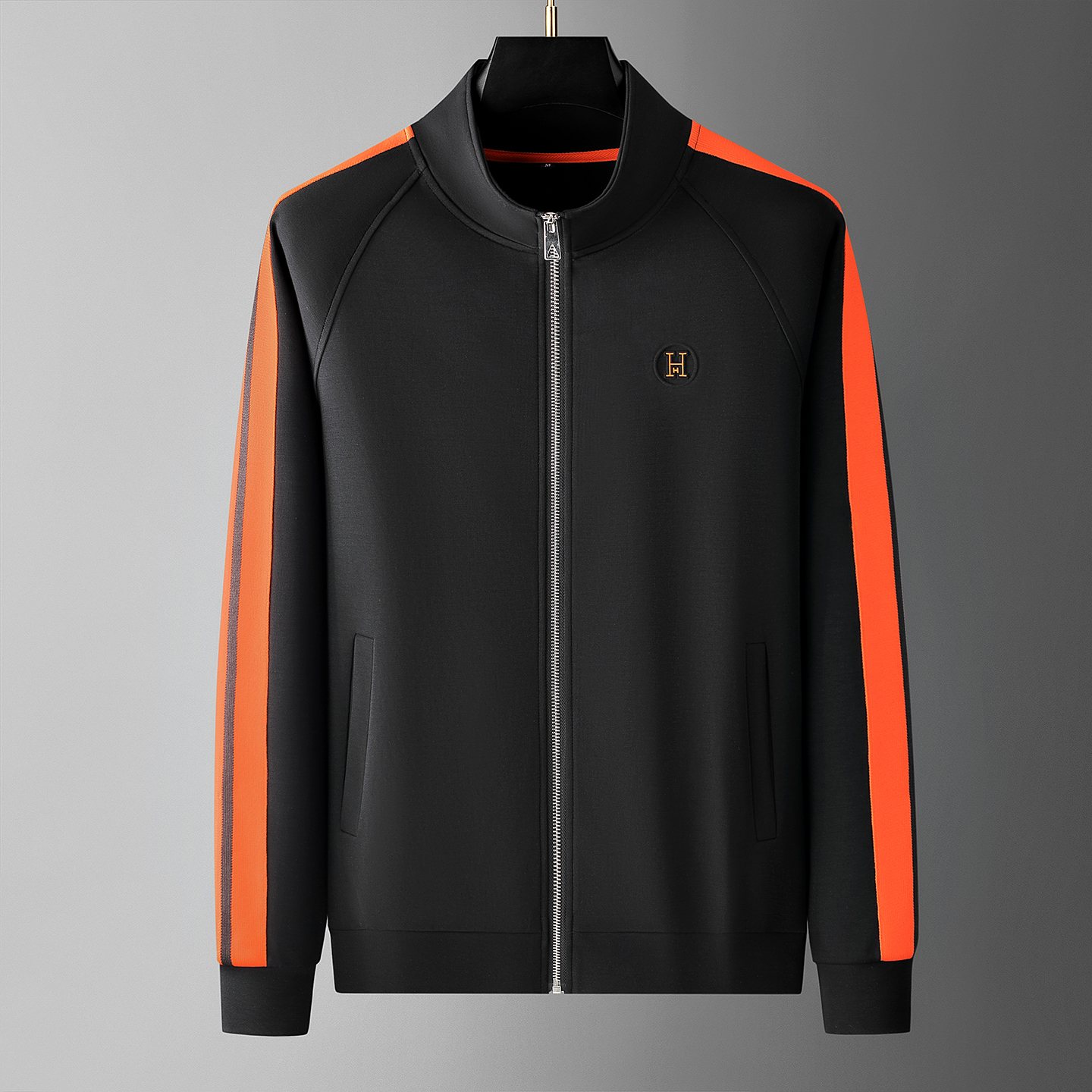 Detailed shot of the contrast stripe on men's Riviera track suit, showcasing premium men's fashion.