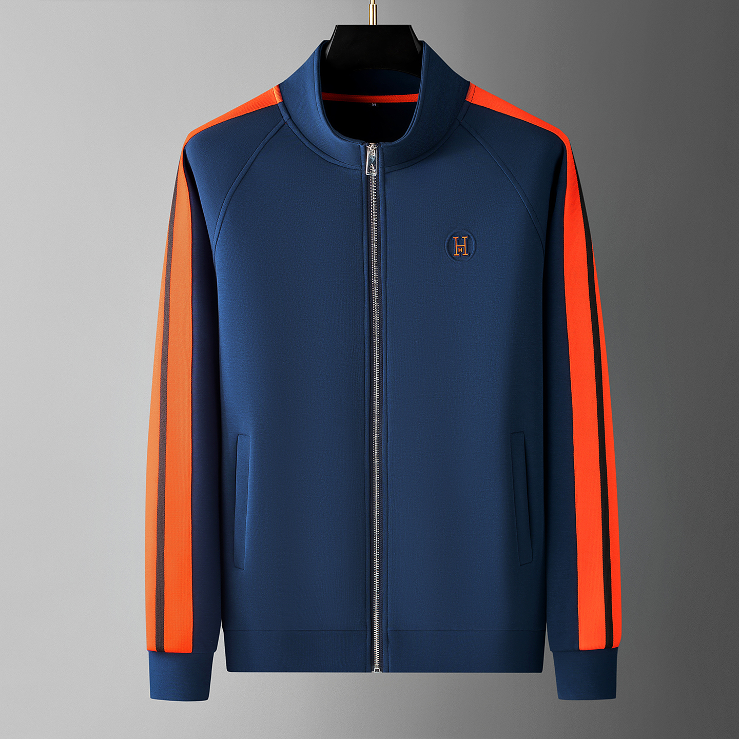 Stylish man wearing comfortable men's Riviera track suit, ideal for everyday style activewear.