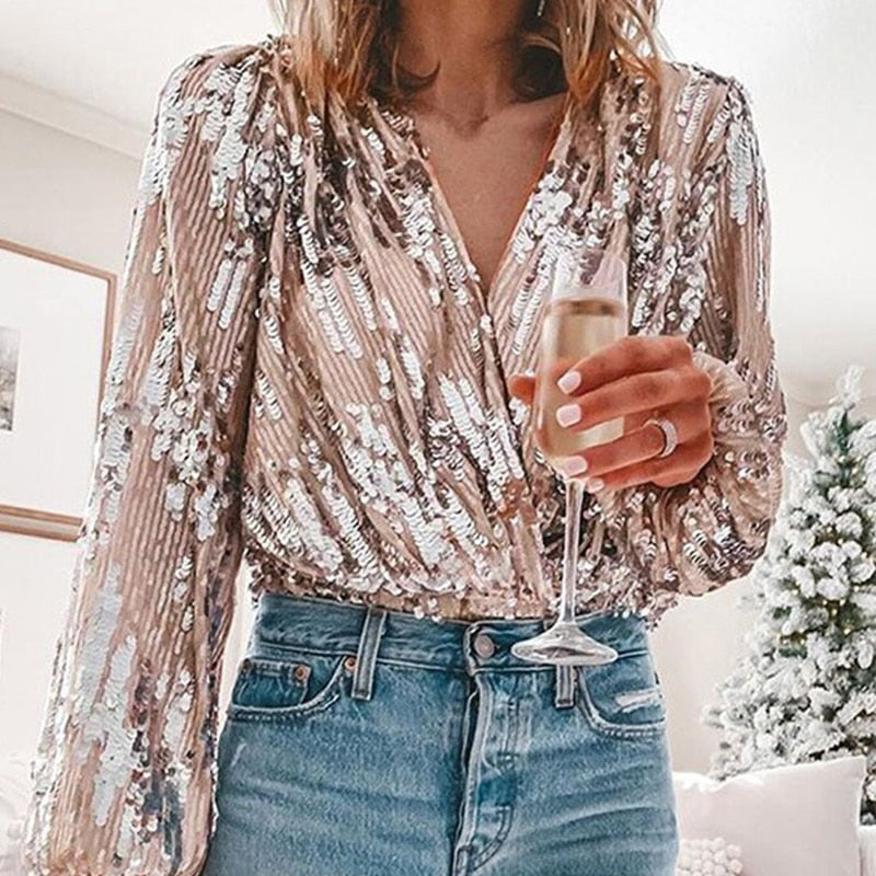 Stylish women's sequin blouse, a sparkling long-sleeve top. Perfect for glam evening wear & party fashion statement.