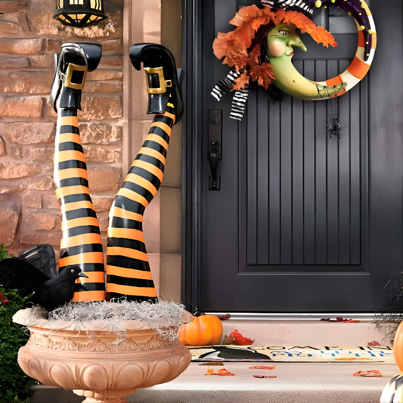 Funny witch leg stakes for Halloween yard decor. Spooky, whimsical outdoor garden resin accents.