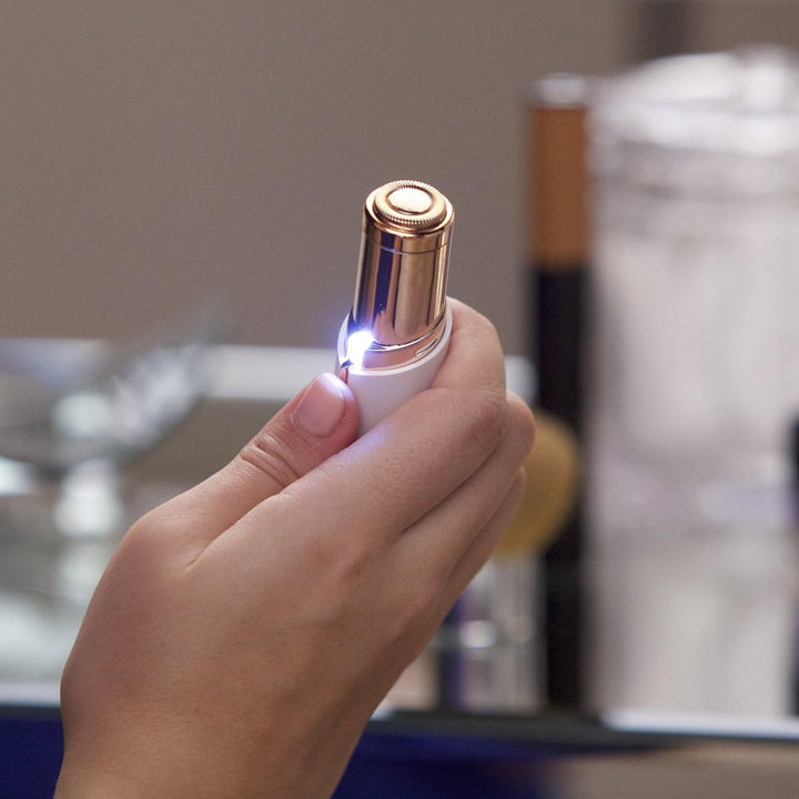 Portable facial hair remover for women, a painless beauty tool for quick, smooth skin touch-ups and daily facial care.