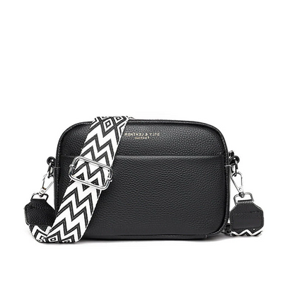 Premium hardware detail on a genuine leather women's tote, enhancing luxury and durability.