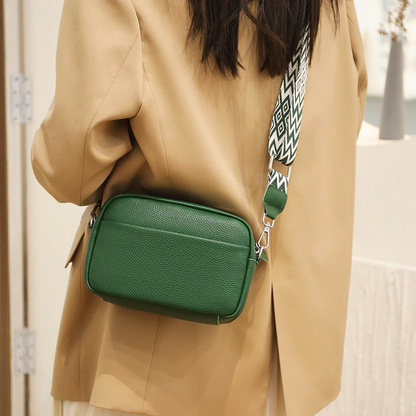 Durable cowhide leather crossbody bag, a versatile women's fashion accessory for daily use.