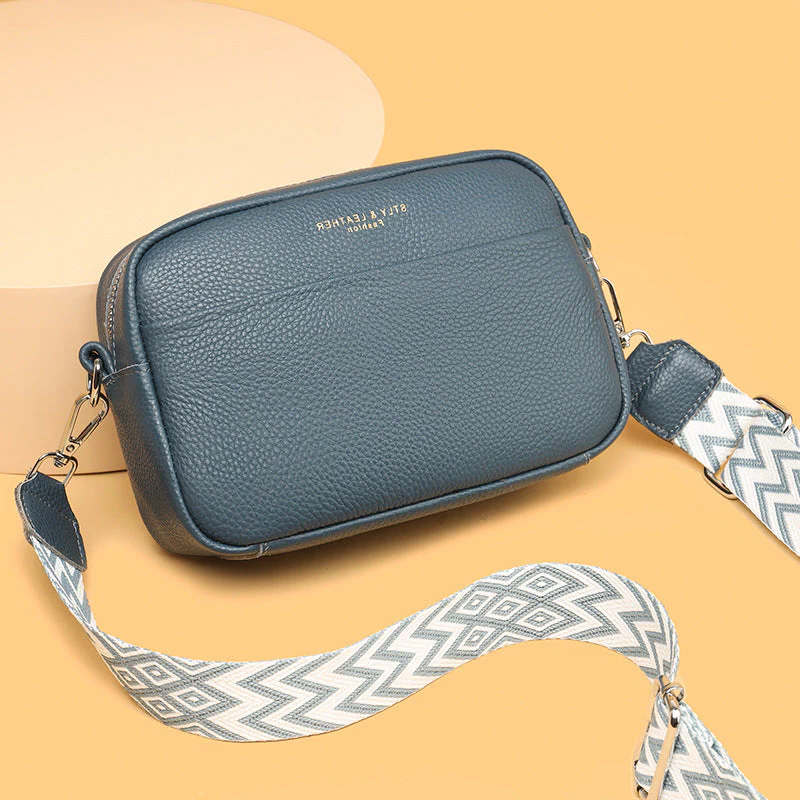 Fashionable woman with a genuine leather crossbody bag, a durable everyday purse.