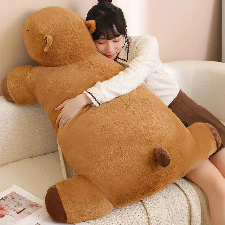 Soft plush giant capybara, an adorable comfort gift & relaxation buddy for all ages.