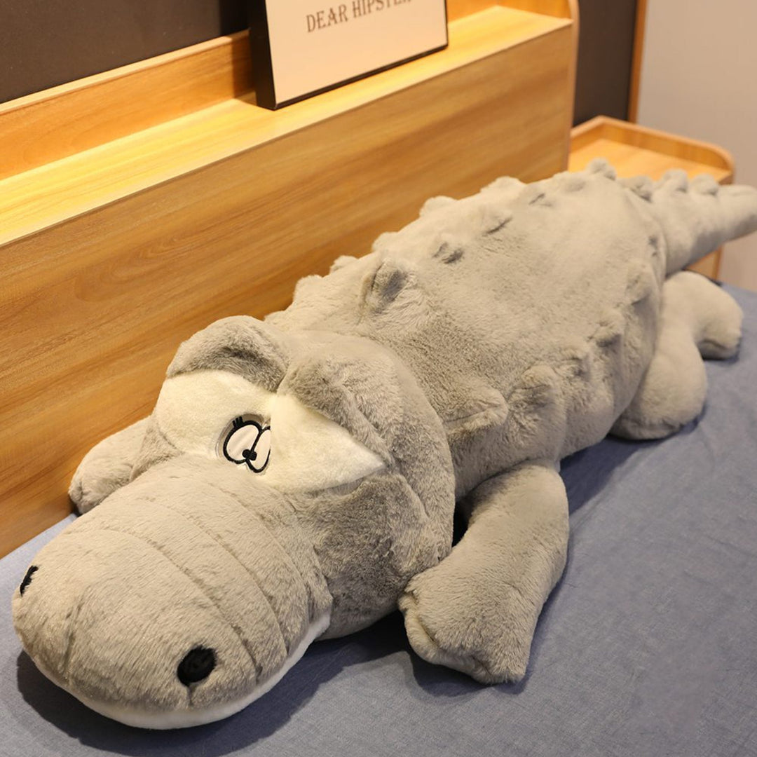 Large green crocodile plush, soft cuddly animal toy. Great for comfort, snuggles, or as fun bedroom decor.