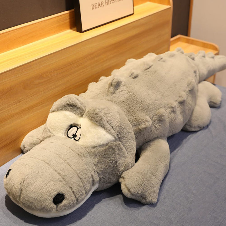 Large green crocodile plush, soft cuddly animal toy. Great for comfort, snuggles, or as fun bedroom decor.