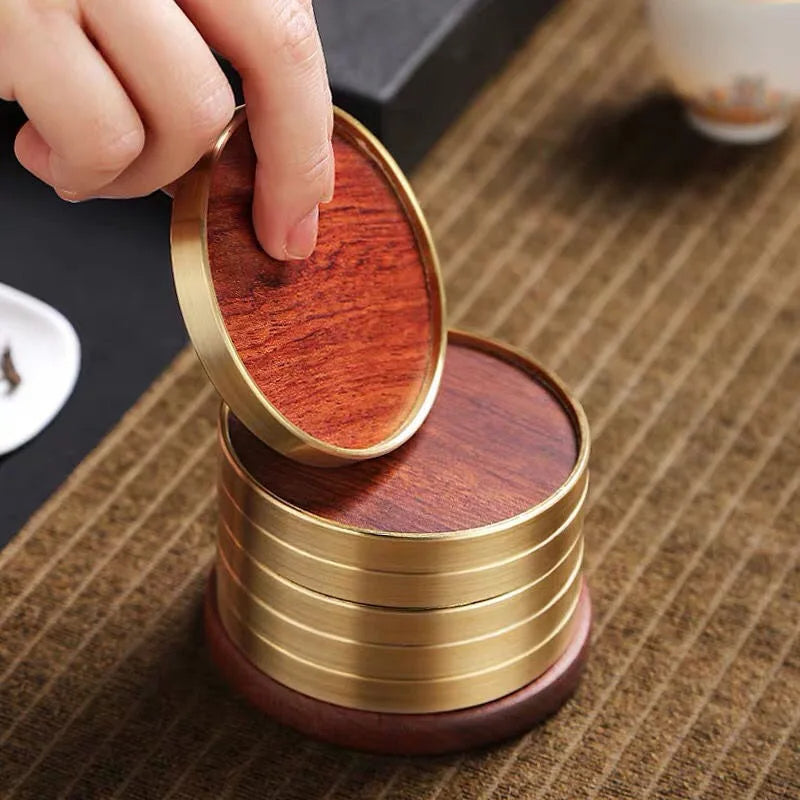 Handcrafted ginkgo wood coasters providing elegant table protection. A luxurious addition to any home decor.