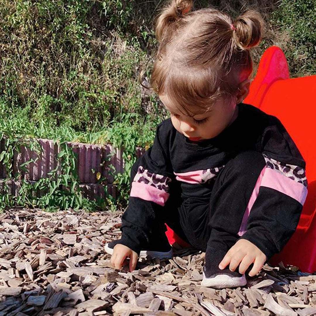 Stylish children's apparel: warm sweater and pants for girls' winter fashion.