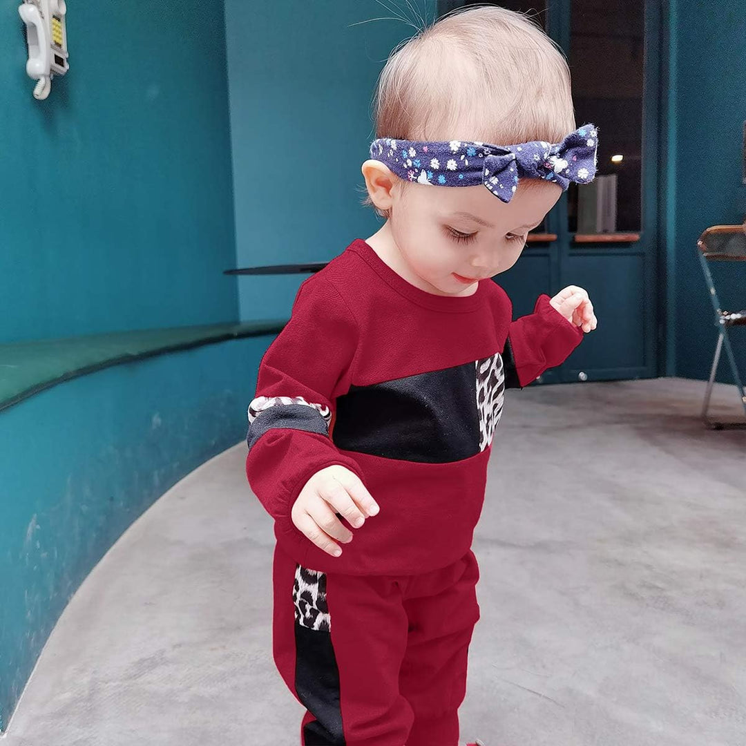 Baby girl's warm sweater & pants, a delightful outfit for cozy moments.