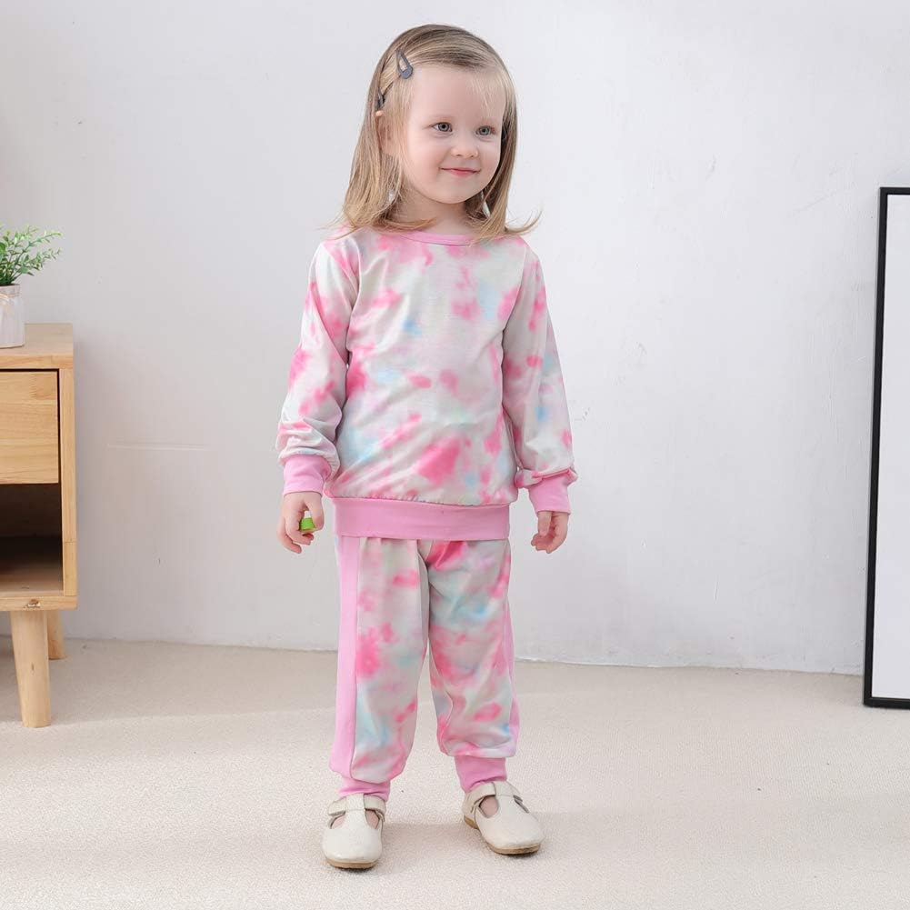 Little girl's winter clothing: snug sweater & matching play pants, toddler set.
