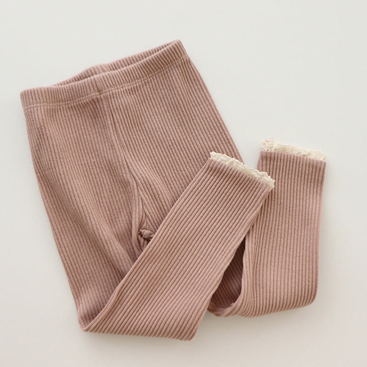 Girls' ribbed baby leggings with delicate lace trim. Soft, comfortable infant pants for everyday wear.