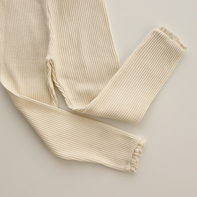 Cute baby girl ribbed leggings with elegant lace trim, perfect toddler fashion for stylish outfits.