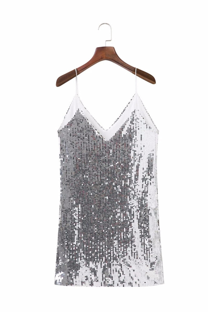 Sparkling silver sequin mini dress, a stylish party dress for women. Ideal for glamorous evenings & special events.