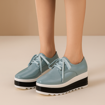 Comfortable women's orthopedic platform shoes, sleek glossy design with secure lace-up closure.