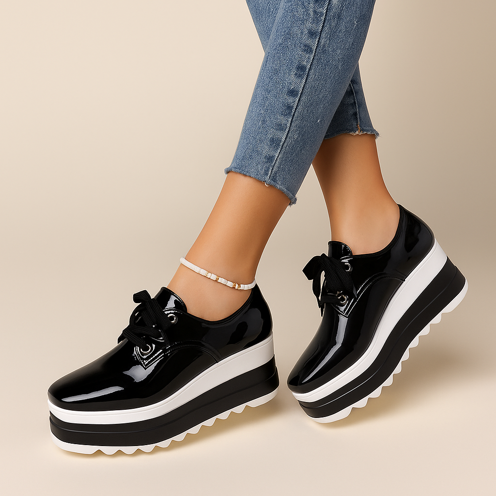 Modern women's glossy platform sneakers, perfect for fashion-forward casual looks and all-day wear.