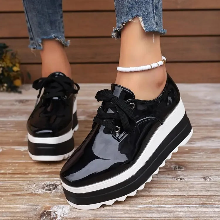 Lace-up women's platform sneakers, glossy exterior, designed for orthopedic comfort & stylish casual wear.