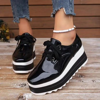 Lace-up women's platform sneakers, glossy exterior, designed for orthopedic comfort & stylish casual wear.