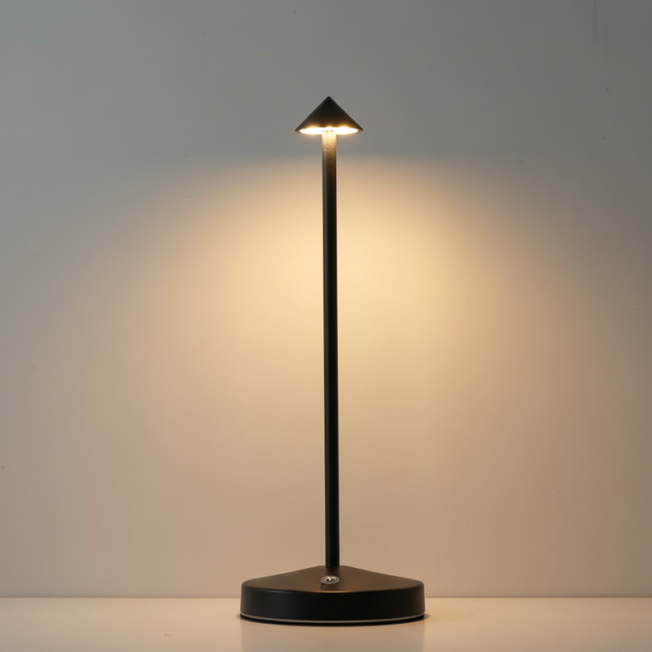 Sleek aluminum GlowArrow cordless LED table lamp providing modern mood lighting for bedroom or living room.