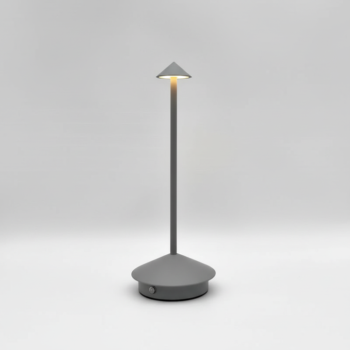 Contemporary GlowArrow portable LED table lamp with a minimalist aluminum design for cordless mood lighting.