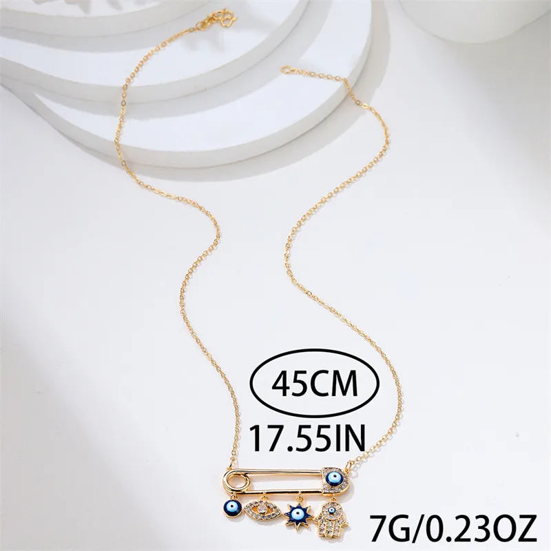 Fashionable women's accessory: Evil Eye pendant necklace, gold plated with shimmering zircon stones for protection.