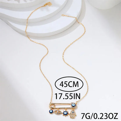 Fashionable women's accessory: Evil Eye pendant necklace, gold plated with shimmering zircon stones for protection.