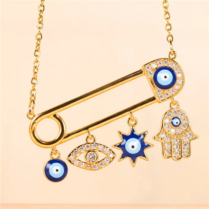 Close-up of a women's Evil Eye necklace, featuring a blue zircon eye on a gold plated pendant.